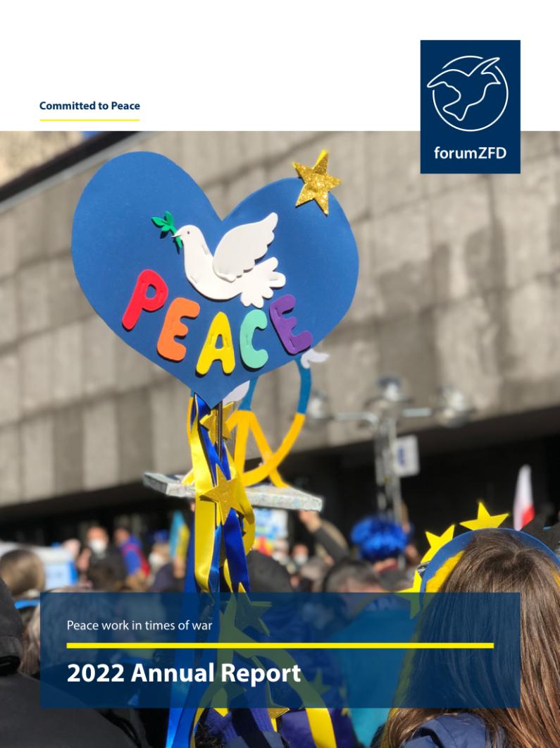 Title of the annual report of forumZFD with a blue heartshaped sign of a dove and the coloured word peace.