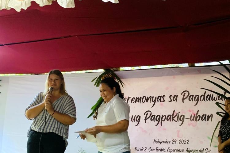 Project Manager Bettina Adamczyk reacts to expression of consent of Manobo indigenous people