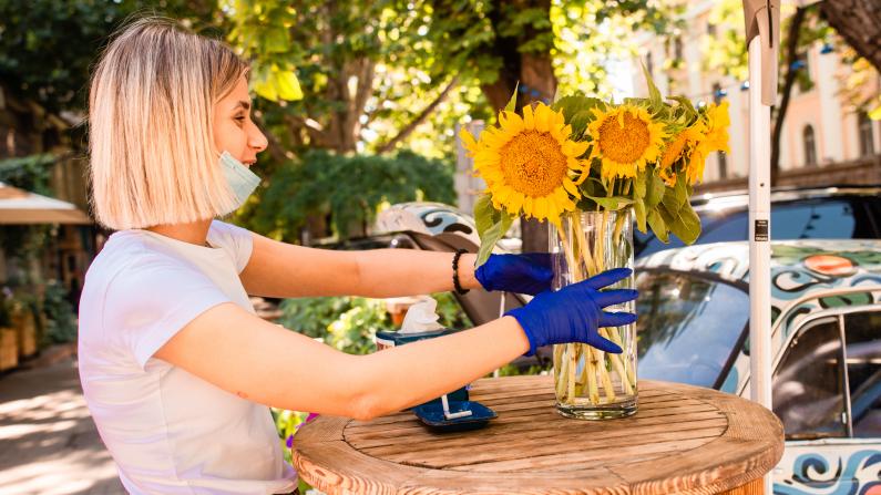 Girl arranging sunflowers in Odesa