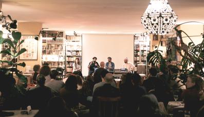 The producers of the Maabar podcast in front of the audience at Barzakh Coffee shop.
